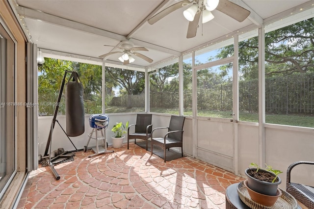 sunroom / solarium with ceiling fan