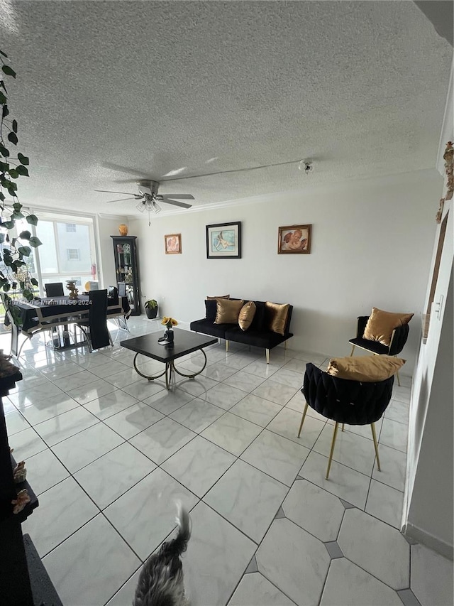 tiled living room with a textured ceiling and ceiling fan