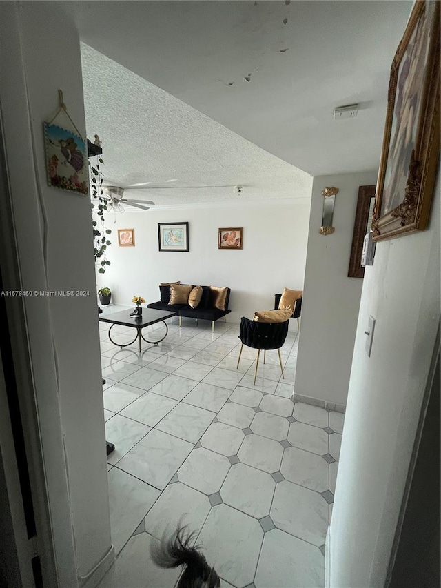 hallway featuring a textured ceiling