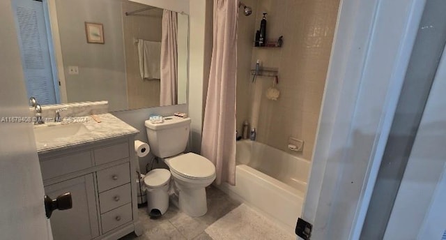 full bathroom with tile patterned flooring, vanity, toilet, and shower / bath combo with shower curtain