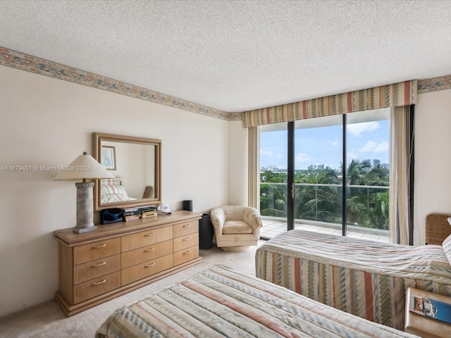 2800 Island Blvd Unit 702, Aventura, FL 33160 - bedroom featuring light colored carpet, access to outside, and a textured ceiling