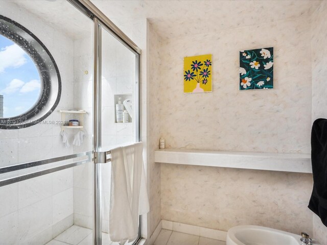 2800 Island Blvd Unit 702, Aventura, FL 33160 - full bathroom with a shower stall, tile patterned flooring, and a bidet