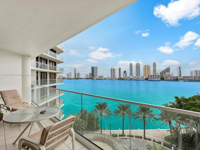 balcony featuring a water view