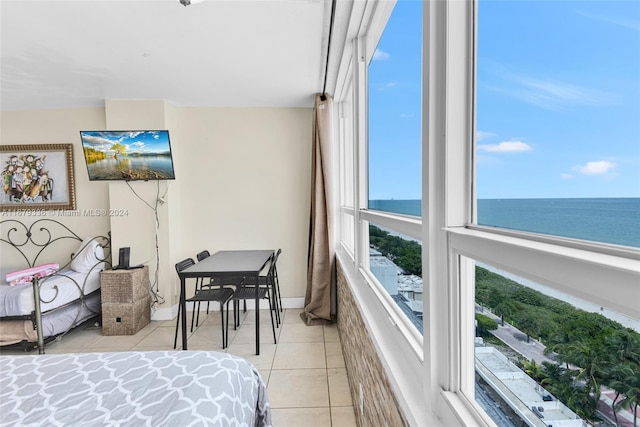 tiled bedroom with a water view