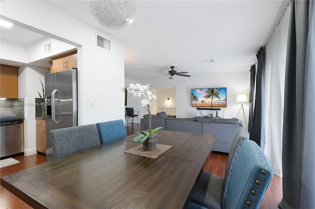 dining area featuring dark wood-type flooring and ceiling fan