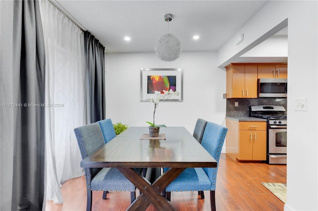 dining area with light hardwood / wood-style flooring