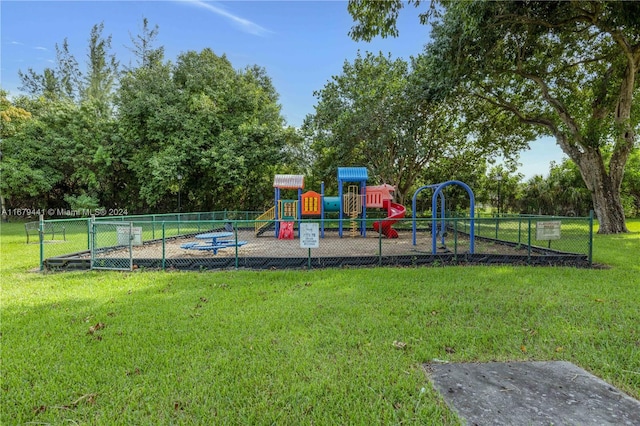 view of playground with a yard