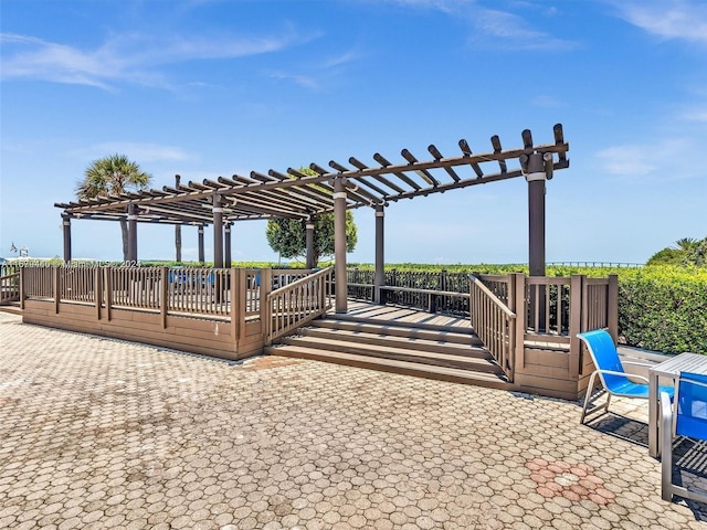 exterior space featuring a deck and a pergola