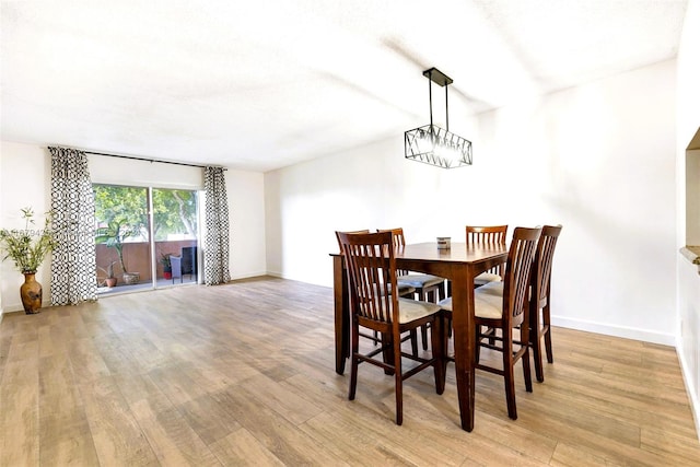 dining area featuring light wood-type flooring