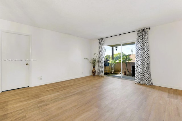 empty room with light hardwood / wood-style floors