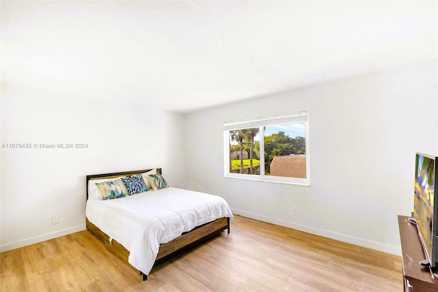 bedroom with light hardwood / wood-style flooring