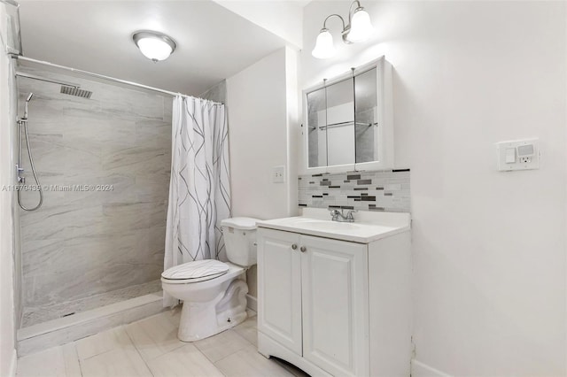 bathroom featuring tile patterned floors, toilet, backsplash, vanity, and walk in shower