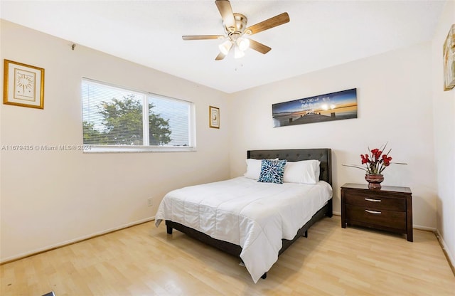 bedroom featuring ceiling fan and light hardwood / wood-style flooring