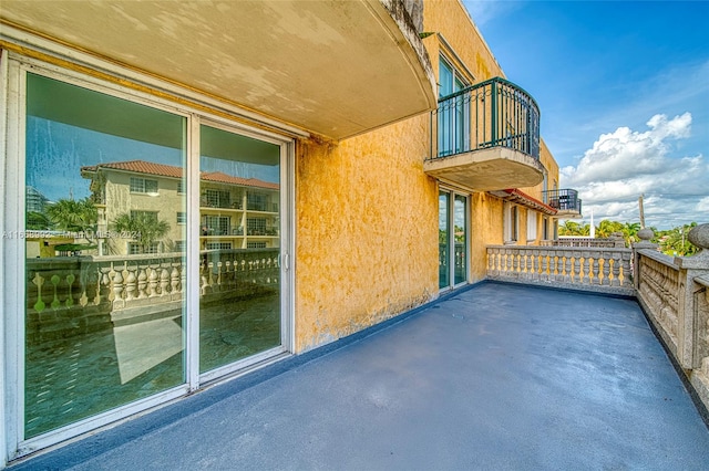 view of patio with a balcony