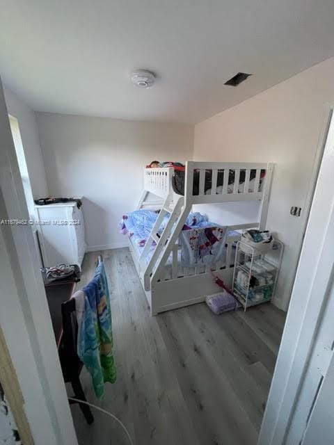 bedroom with light hardwood / wood-style flooring