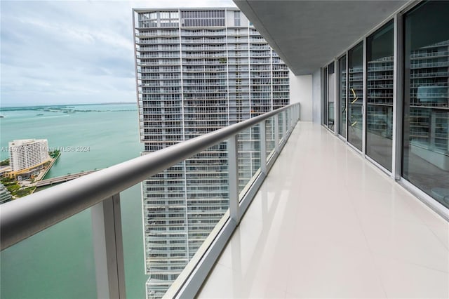 balcony featuring a water view