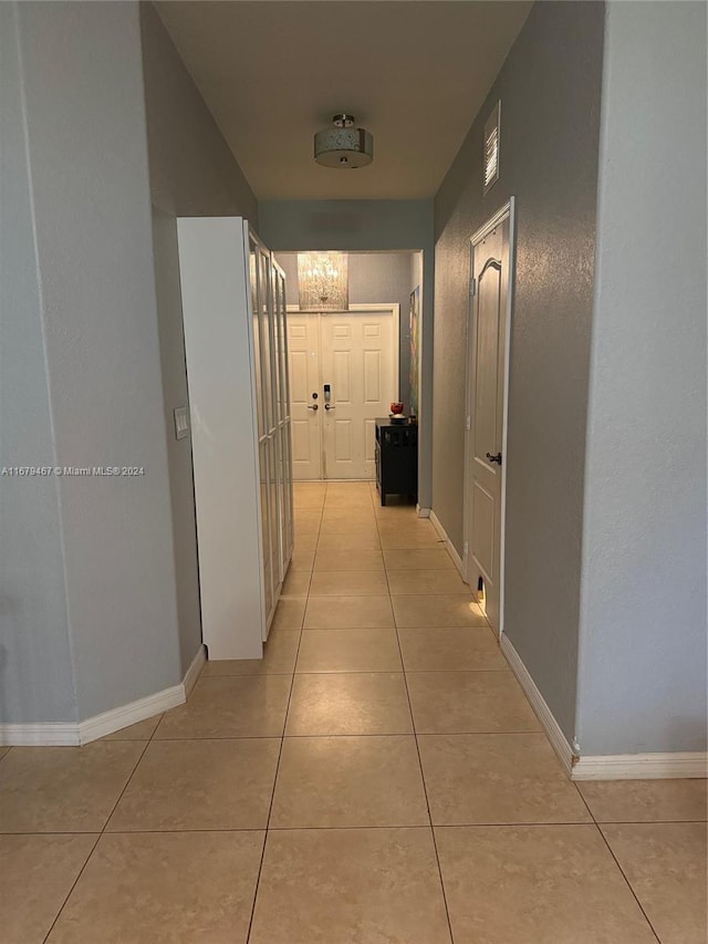 hallway with light tile patterned flooring