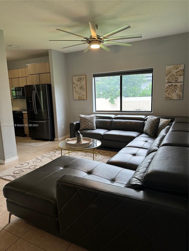 living room with light tile patterned flooring and ceiling fan