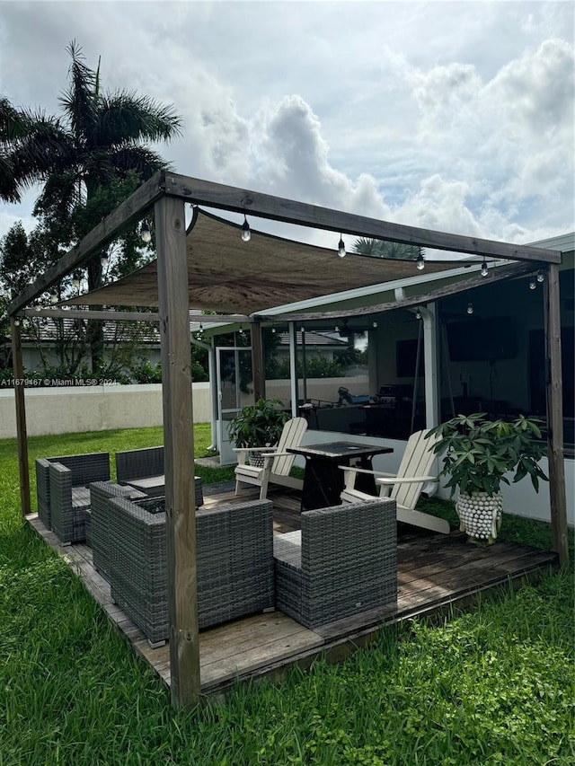 view of patio / terrace featuring a wooden deck and an outdoor living space