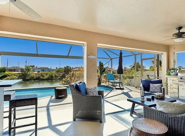 sunroom with a pool and ceiling fan