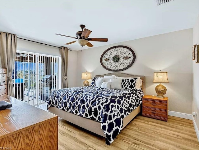 bedroom with light hardwood / wood-style floors, access to outside, and ceiling fan