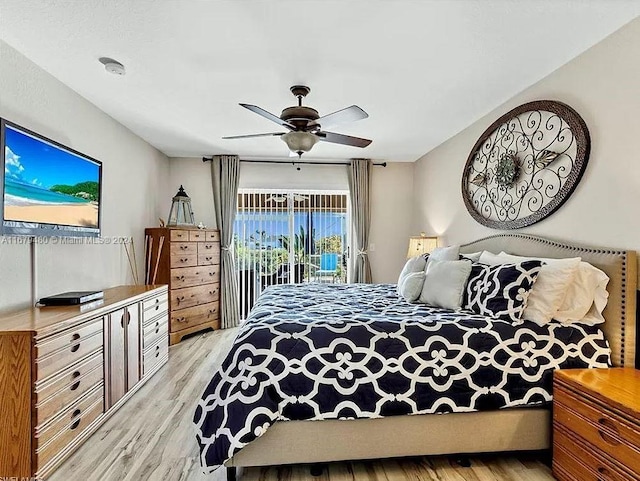 bedroom with light hardwood / wood-style floors, access to exterior, and ceiling fan