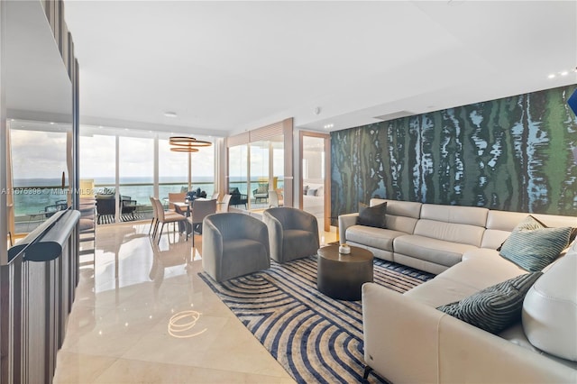 tiled living room with a water view and a wall of windows