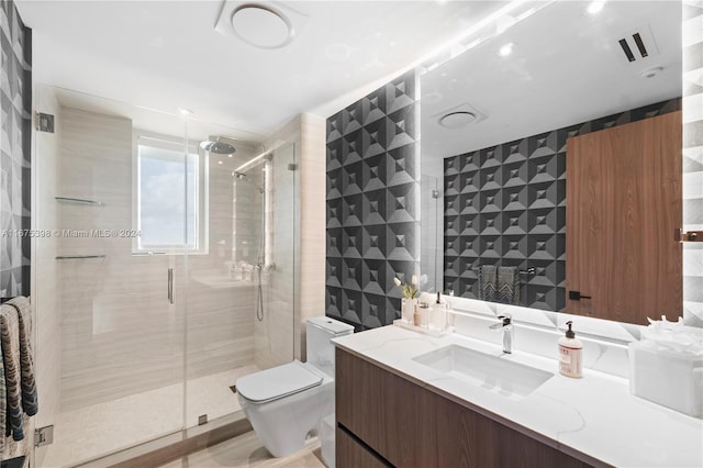 bathroom with toilet, a shower with door, vanity, tile walls, and hardwood / wood-style flooring