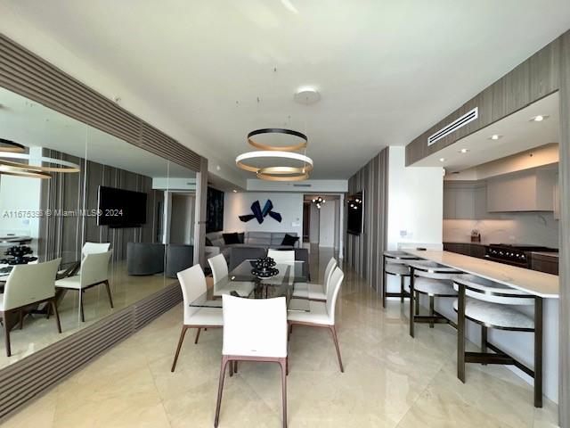 dining room featuring a chandelier