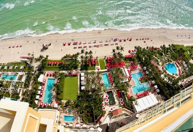 drone / aerial view with a view of the beach and a water view