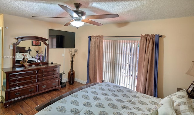 bedroom featuring ceiling fan, a textured ceiling, and dark hardwood / wood-style floors