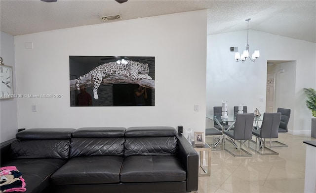 living room with vaulted ceiling and an inviting chandelier