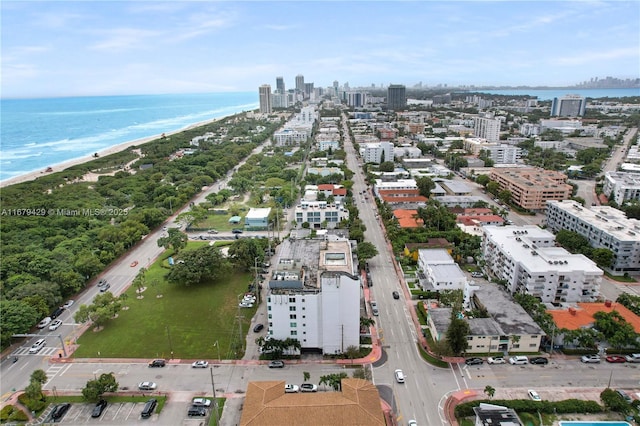 bird's eye view featuring a beach view and a water view