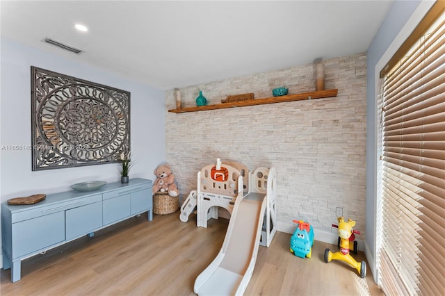 playroom featuring light wood-type flooring