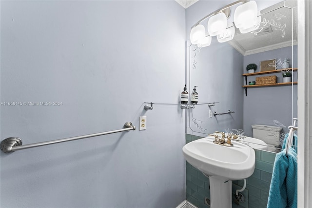 bathroom with toilet and crown molding