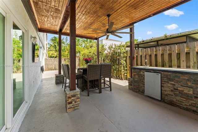 view of patio / terrace featuring ceiling fan