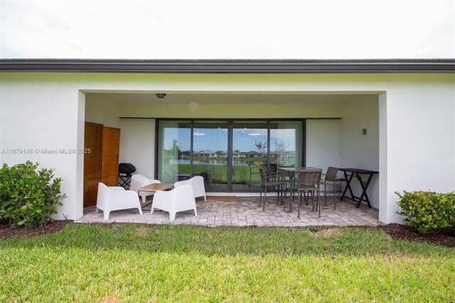 exterior space featuring a patio and a lawn