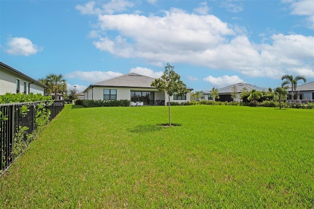 view of yard featuring a residential view and fence