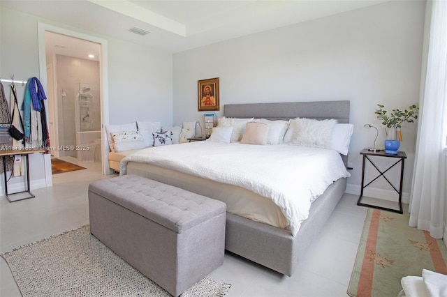 bedroom featuring light tile patterned floors, baseboards, visible vents, and connected bathroom