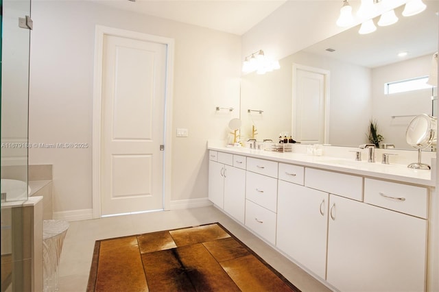 4527 Blessed Place Dr, Oakland Park, FL 33309 - bathroom with double vanity, tile patterned floors, and baseboards