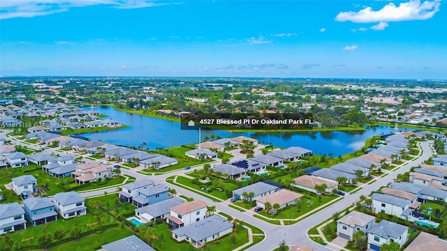 aerial view featuring a residential view and a water view