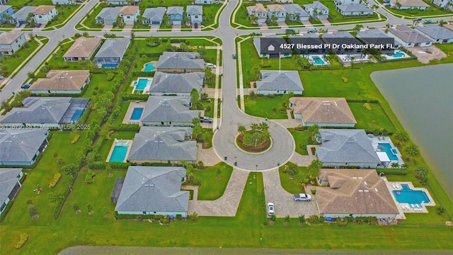 4527 Blessed Place Dr, Oakland Park, FL 33309 - aerial perspective of suburban area with a pool