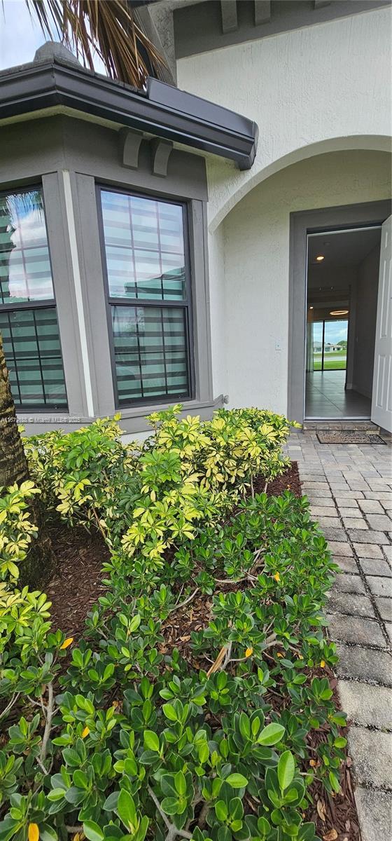 4527 Blessed Place Dr, Oakland Park, FL 33309 - doorway to property featuring stucco siding