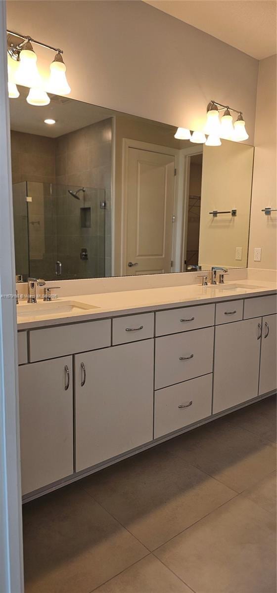 4527 Blessed Place Dr, Oakland Park, FL 33309 - full bathroom featuring a stall shower, tile patterned floors, and double vanity