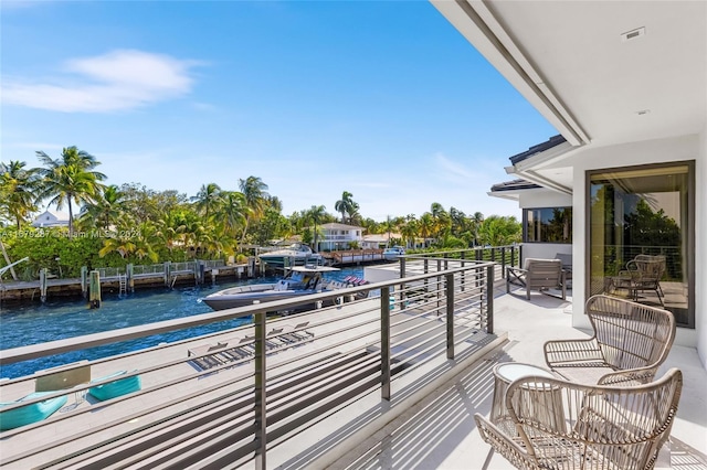 balcony featuring a water view