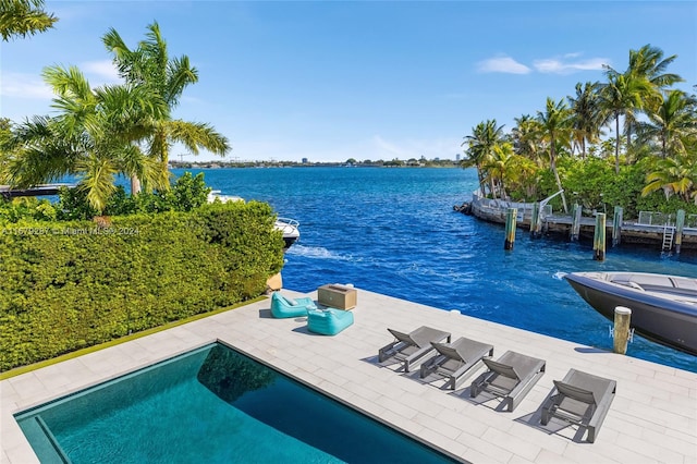 view of pool with a water view