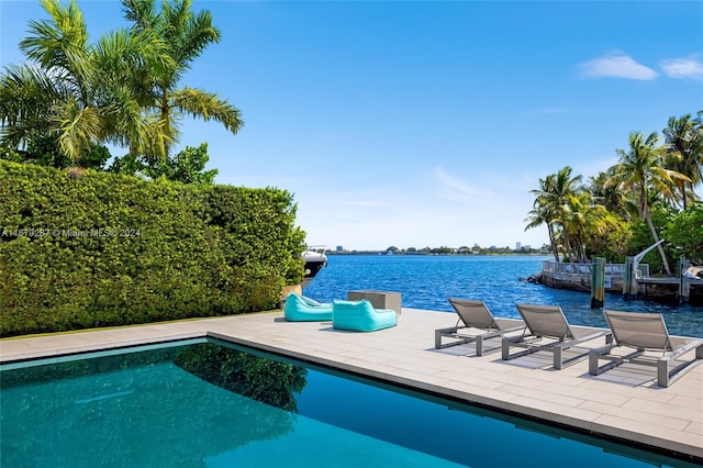 view of pool with a water view