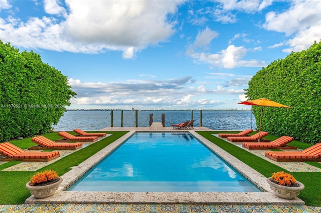 view of swimming pool featuring a water view