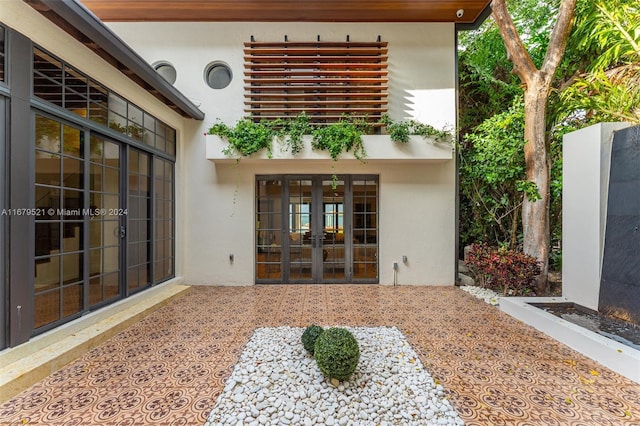 property entrance with french doors and a patio