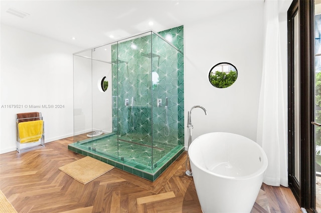 bathroom with parquet floors and plus walk in shower